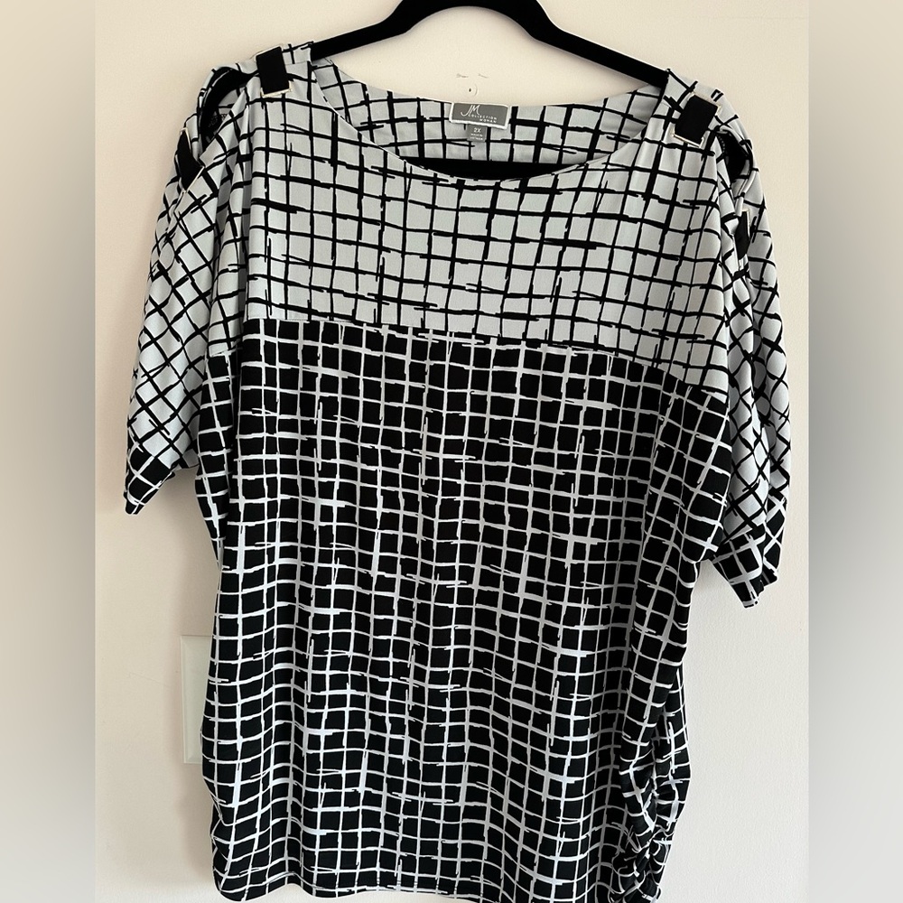 JM Collection Black and White top with gold accents and peek-a-boo shoulder.